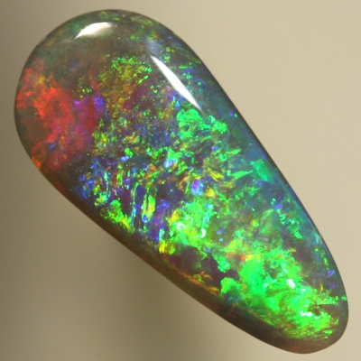 SOLID SEMI BLACK OPAL Pretty glittery show of greens and golds over blue and red. SEE VIDEO